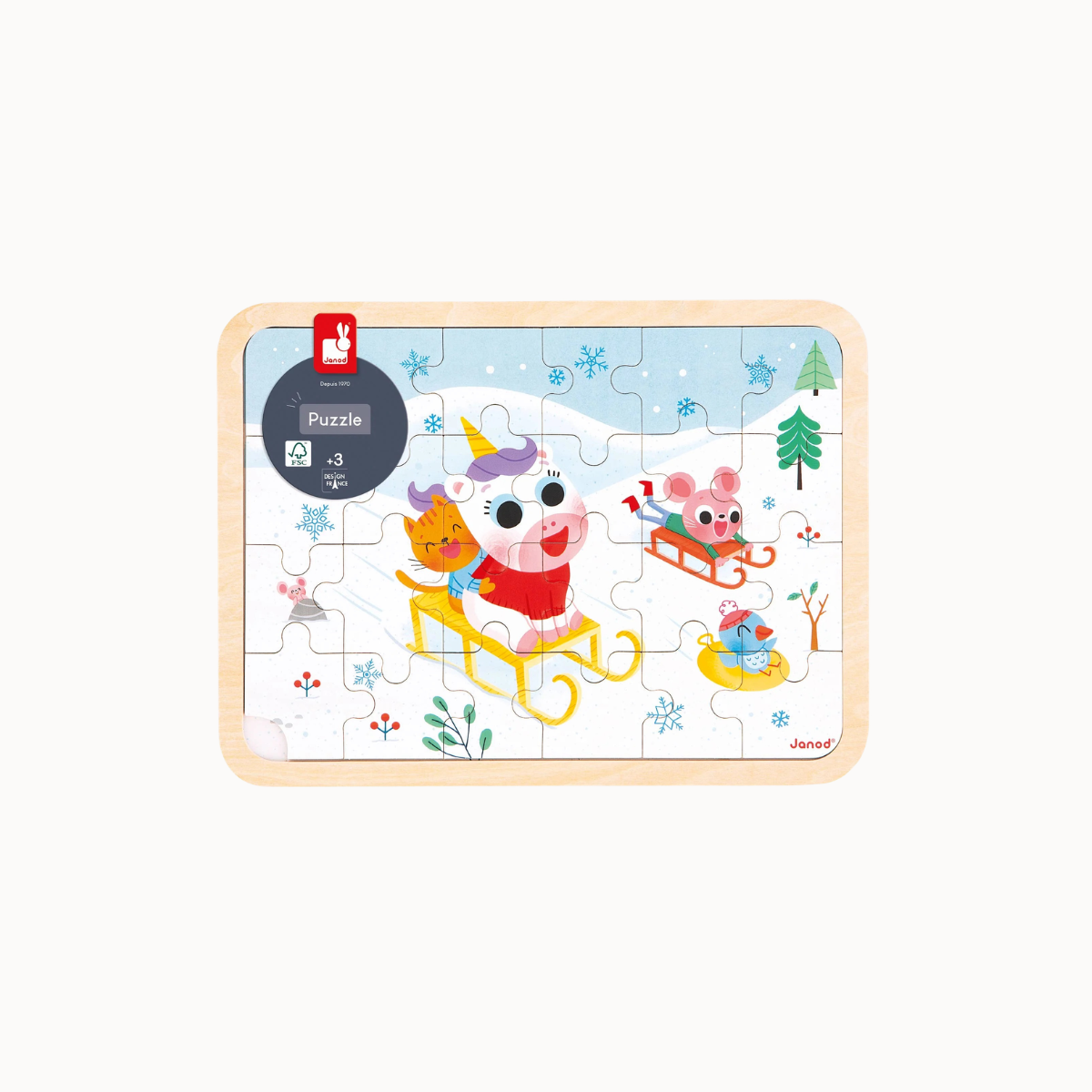 A rectangular wooden children's jigsaw puzzle featuring a winter scene with cartoon animals in sleds, shown completed on a light gray background. The puzzle has a light natural wood border and a printed illustration with blue snow, green trees, red clothing, and multicolored animal details.