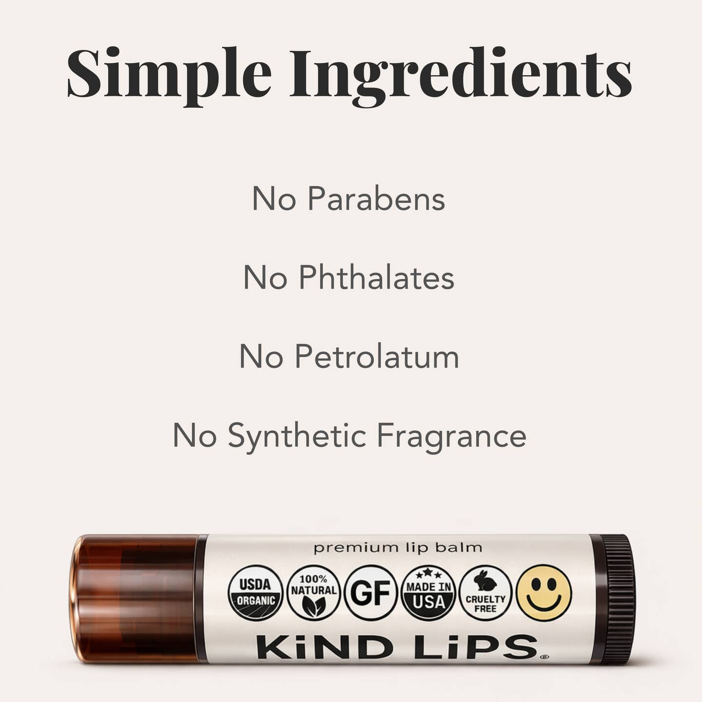 Lip balm with 'Kind Lips' branding and ingredient information on a white background