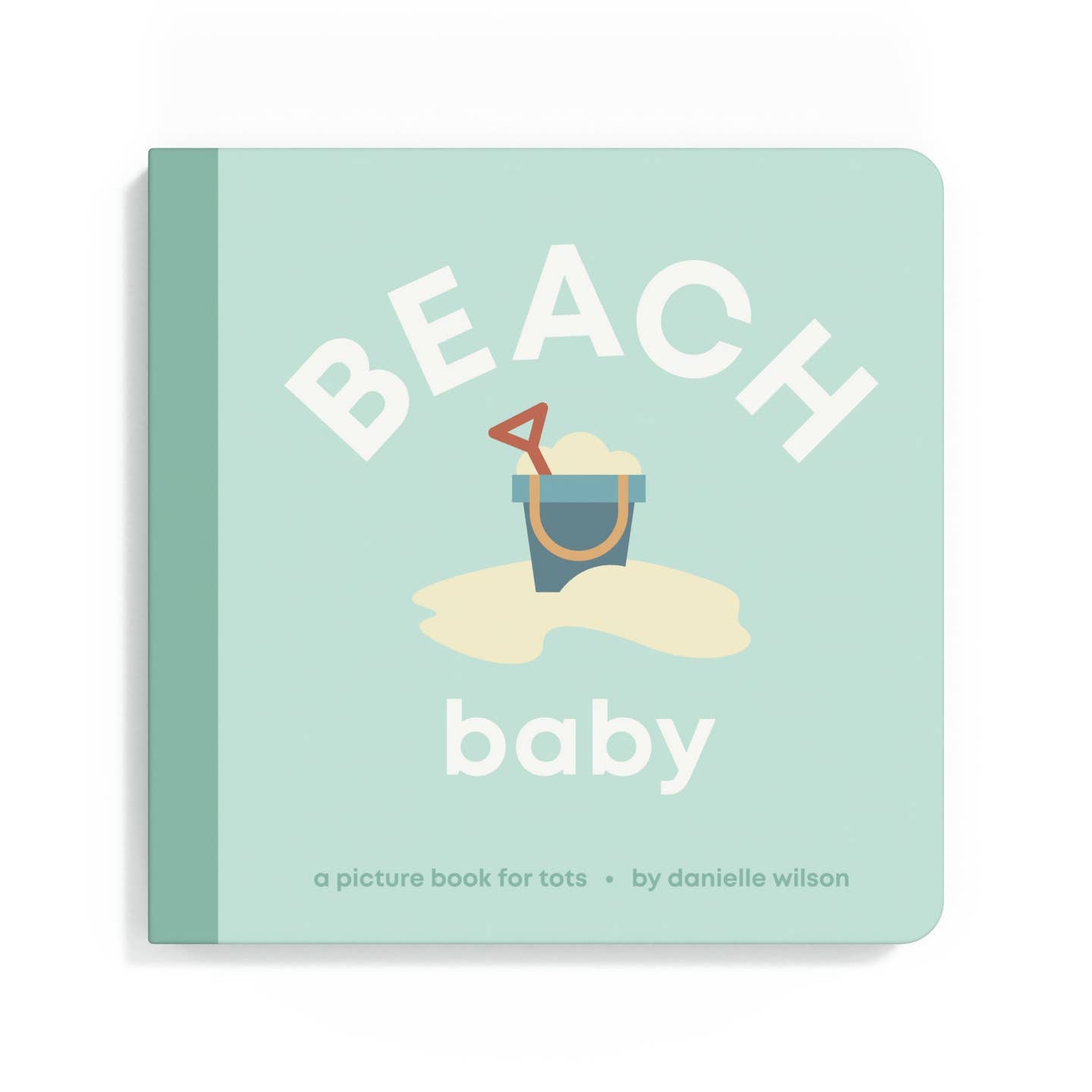 Book titled 'Beach Baby' with a sand bucket and shovel illustration on a light green background