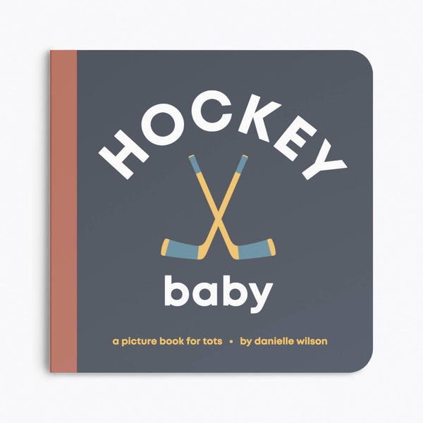 Book titled 'Hockey Baby' with hockey sticks on a dark blue background