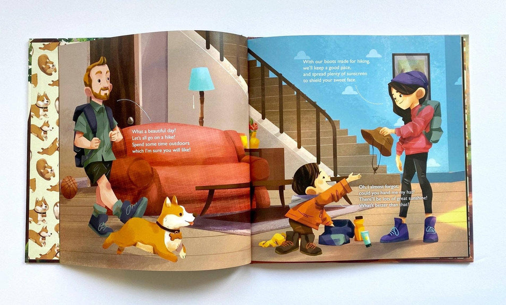 An open illustrated children's book spread showing two cartoon children in a living room with a dog and staircase, photographed against a plain light background.