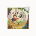 Children's board book titled "Let's Go on a Hike!" by Katrina Liu, illustrated by Heru Setiawan, featuring a colorful illustration of a boy hiking with a dog in a forest. A Silver Medal from the National Book Award for Children is displayed in the top right corner.