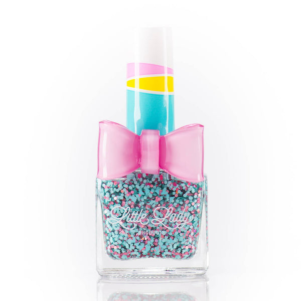 Nail polish bottle with a colorful design and bow on a white background