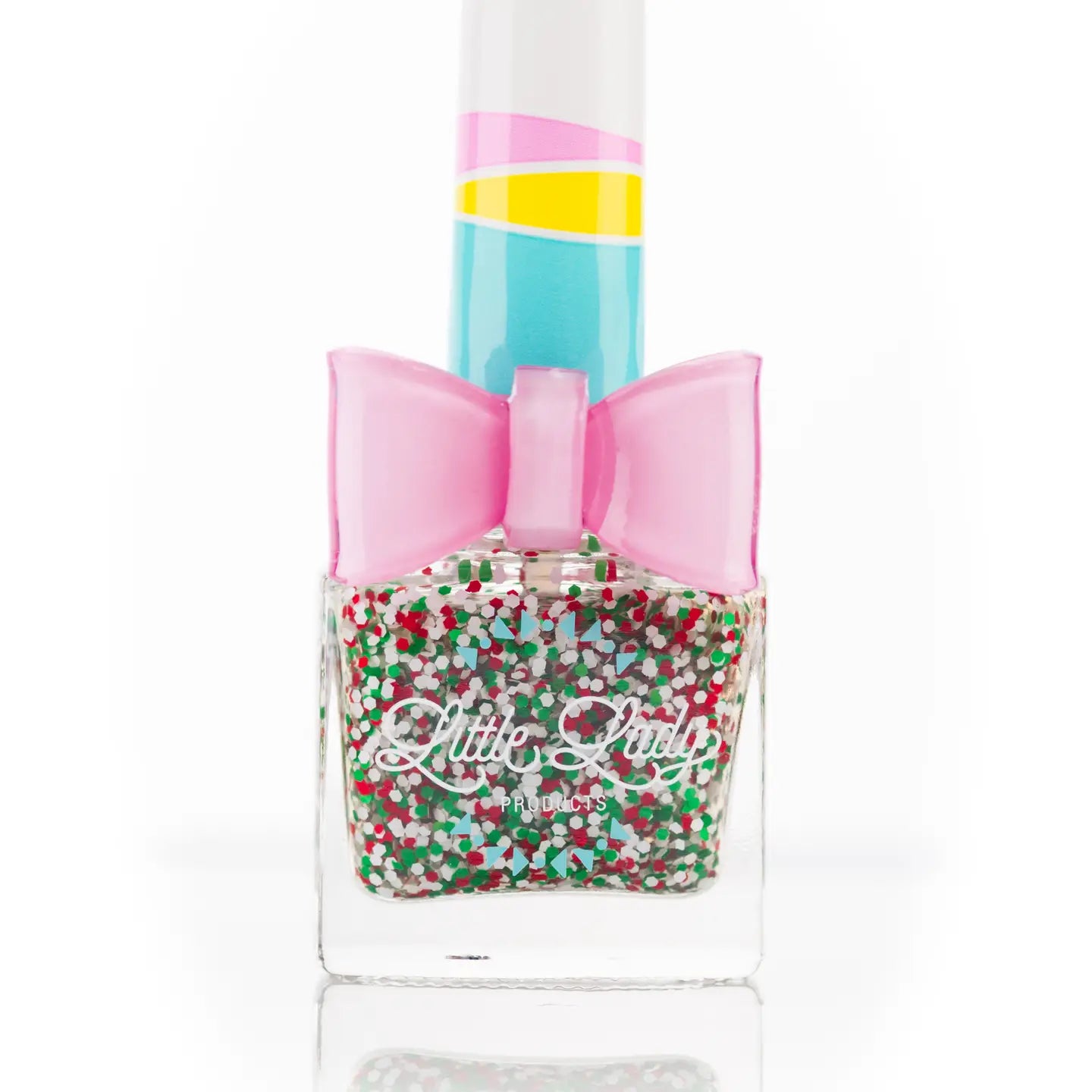 Nail polish with colorful glitter and a pink bow on a white background