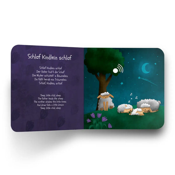 Children's book open to a page with sheep under a tree at night, accompanied by a nursery rhyme.