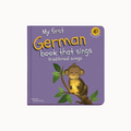 My first German book that sings traditional songs children's board book with a purple cover, featuring a cartoon monkey on a branch and yellow title text.