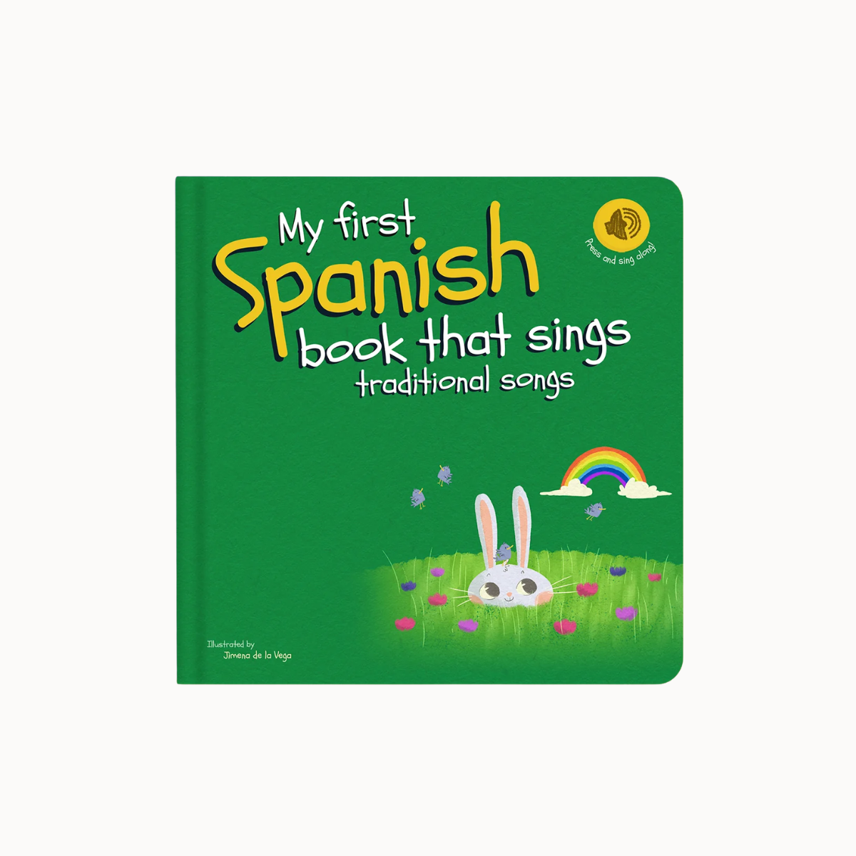 My First Spanish Book That Sings: Traditional Songs children's board book with a green cover, yellow and white title text, a cartoon rabbit, grass, flowers, rainbow, and a small gold 'Pura and Andy Wolf' logo on a white background.