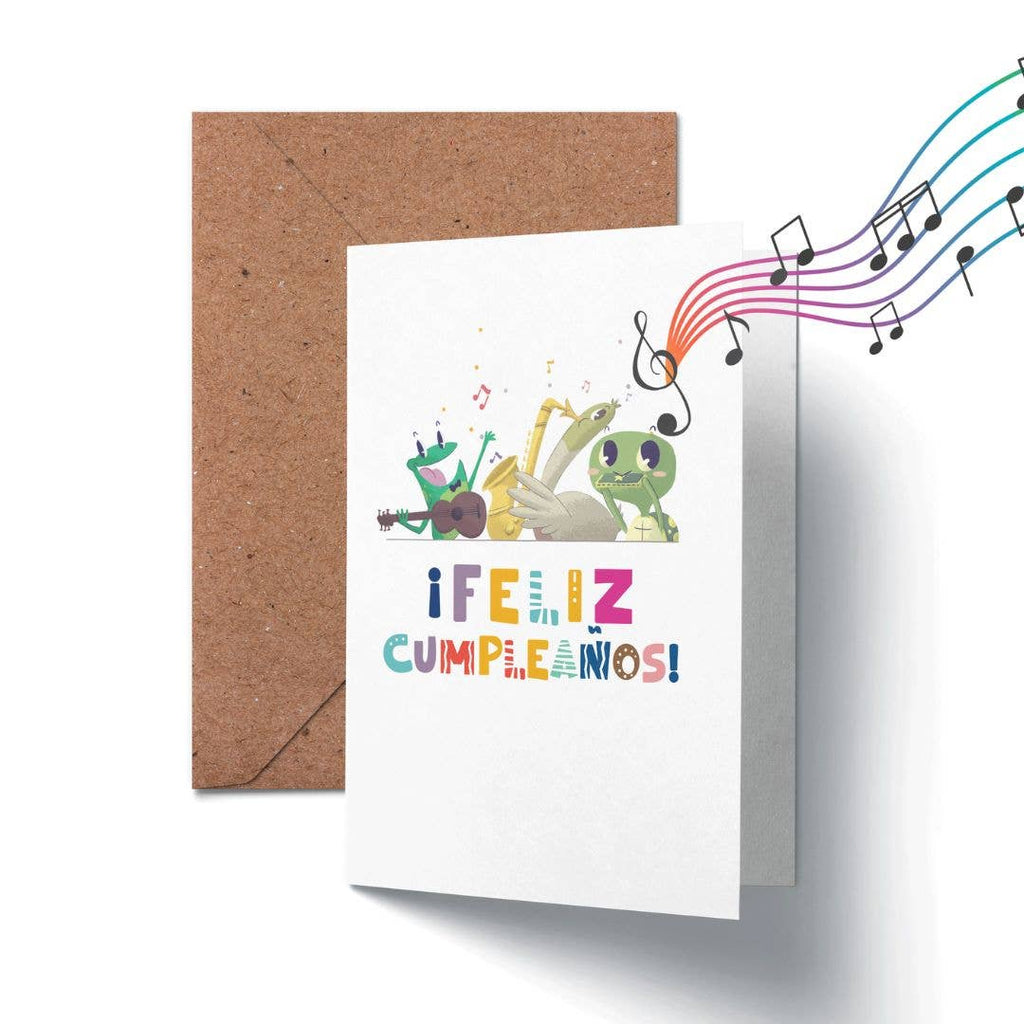 Greeting card with colorful illustrations of hands playing instruments and musical notes, featuring the text 'ifeliz cumpleaños!' on a white background.
