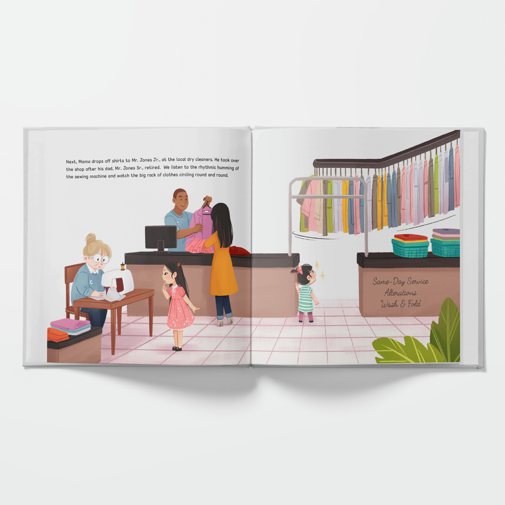 Illustrated book open to a page showing a clothing store interior with people shopping.
