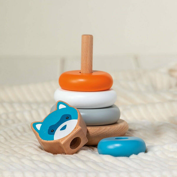 Stack of colorful wooden toys on a soft surface