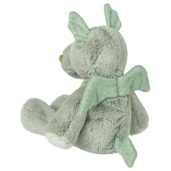 Green plush toy with a bow on a white background