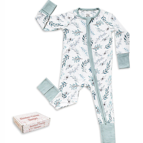 Baby onesie with floral pattern and matching items on a white background