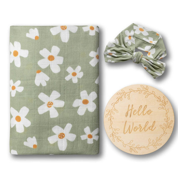 Baby items set with floral patterned blanket, headband, and 'Hello World' plaque on a white background