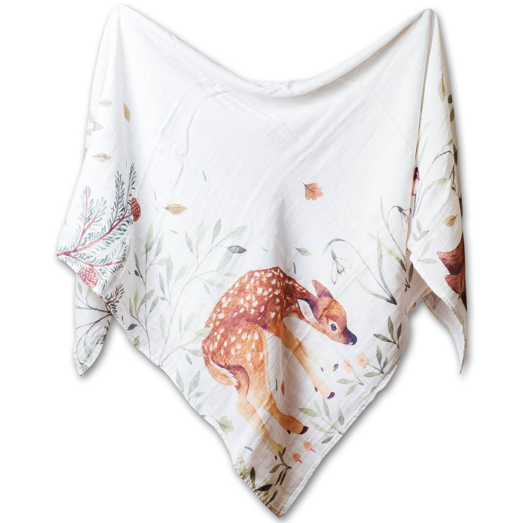 Baby blanket with deer and floral pattern on a white background