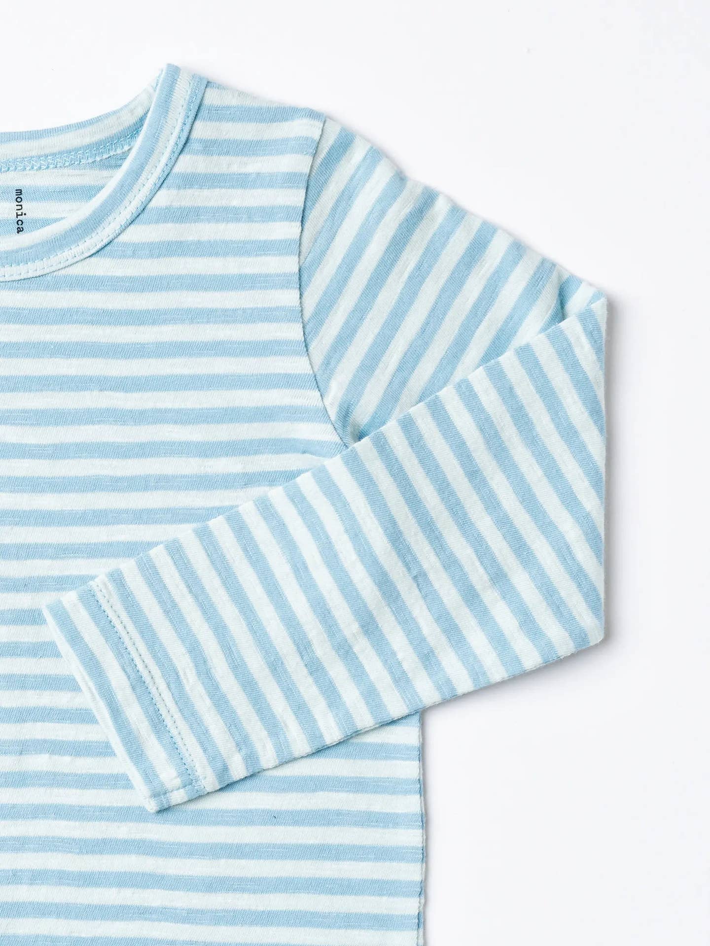 Blue and white striped long-sleeve shirt on a white background