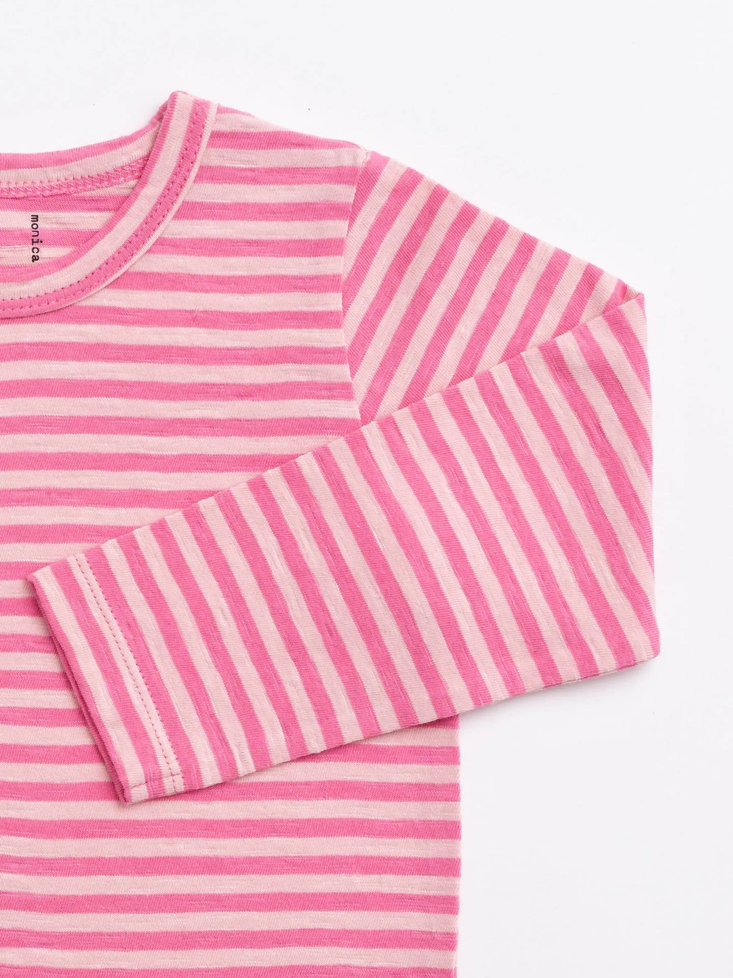 Pink and white striped long-sleeve shirt on a white background