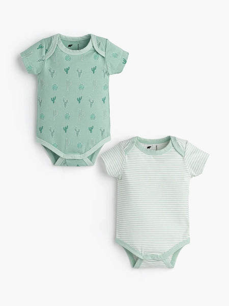 Two green baby bodysuits with different patterns on a white background