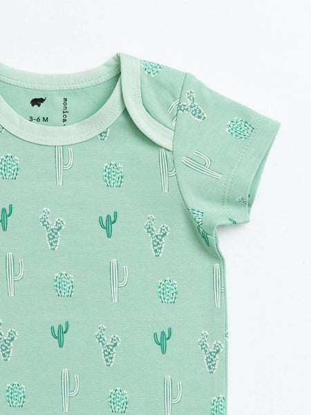 Mint green baby onesie with cactus pattern on a white background