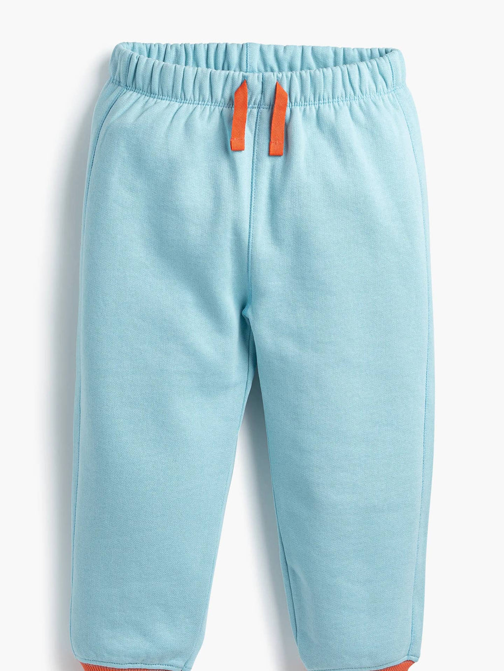 Light blue pants with orange accents on a white background