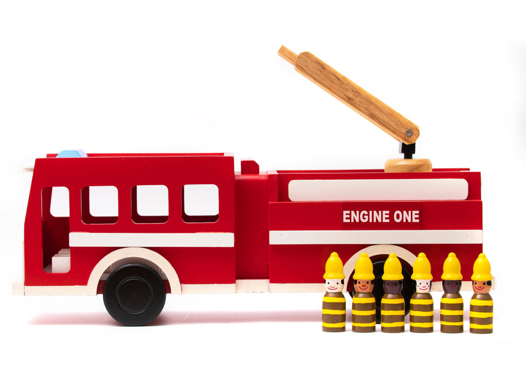 A wooden toy fire truck in red and white with a light wood arm, shown on a white background with small wooden firefighter figures in front.