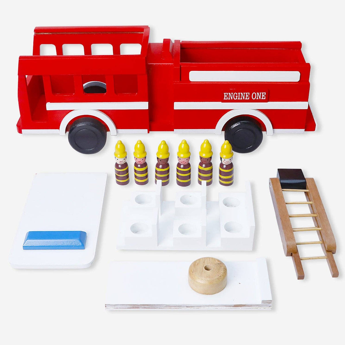 A wooden fire engine toy set with red and white truck body, black wheels, six striped firefighter helmets, a small wooden ladder, and several white accessories on a light gray background.