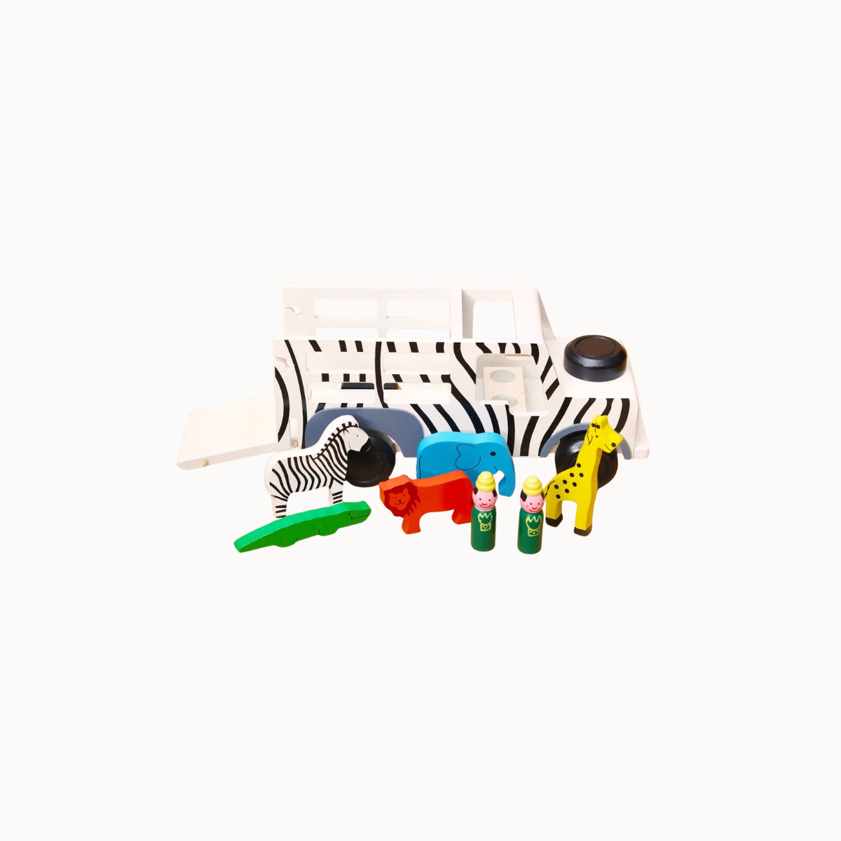 A children's wooden safari-themed toy set on a white background, featuring a white and black zebra-patterned transport truck with a ramp, plus small animal figures and people figures in green, red, blue, yellow, and orange.