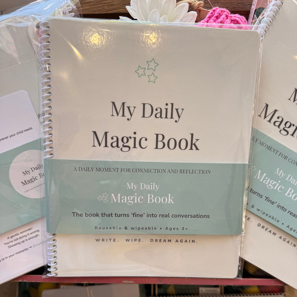 Collection of 'My Daily Magic Book' with a focus on one book in the foreground.