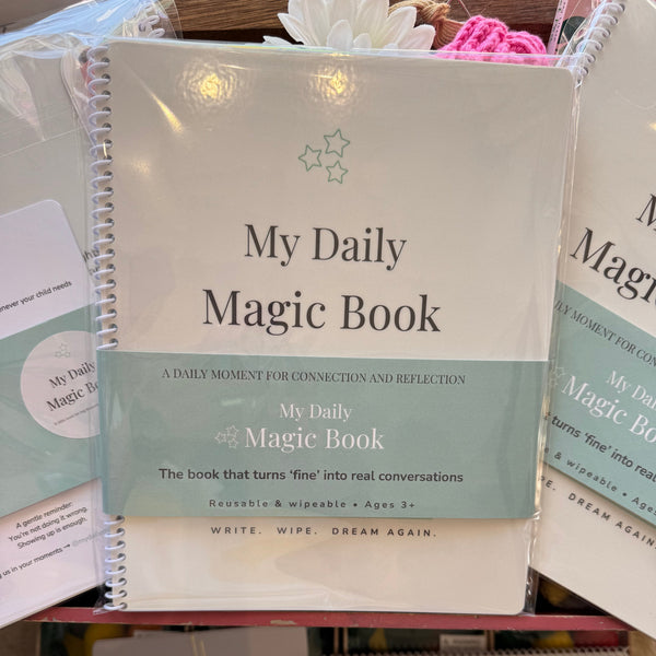 Collection of 'My Daily Magic Book' with a focus on one book in the foreground.