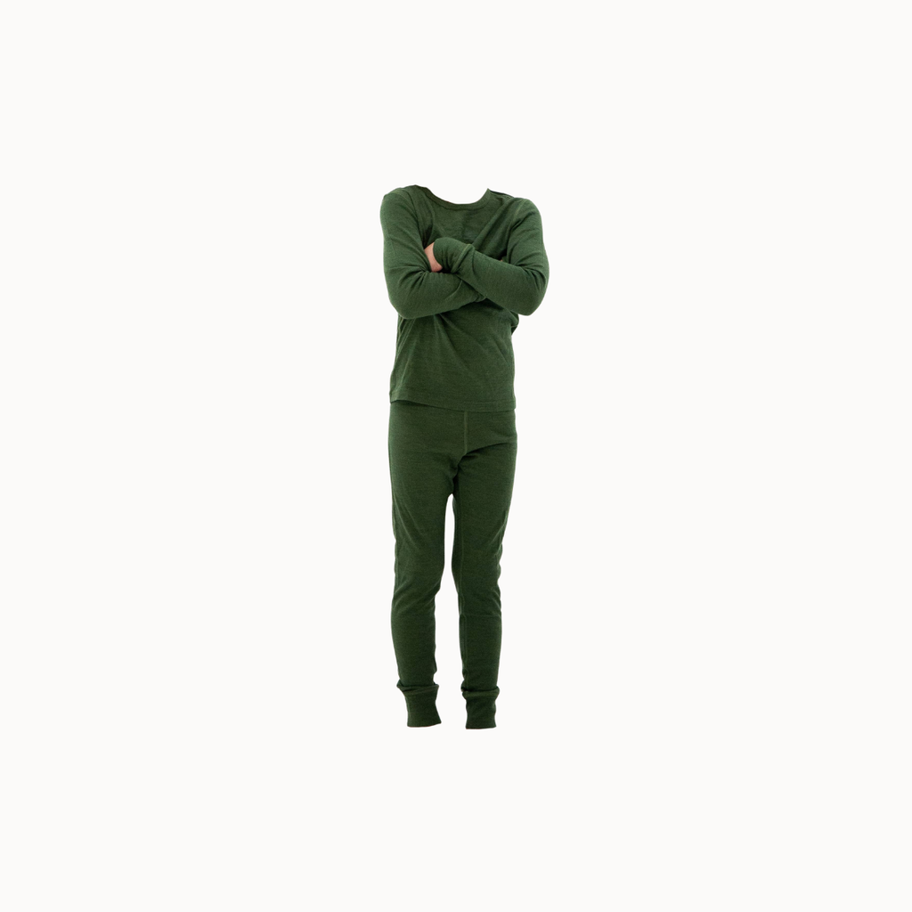 A person wearing a matching dark green long-sleeve top and jogger pants set, standing with arms crossed against a plain white background.