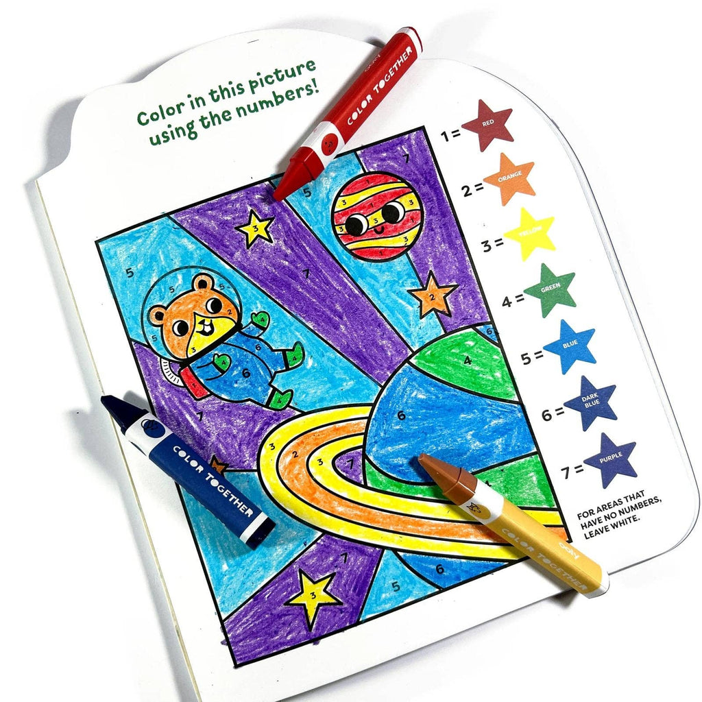 Coloring book with space-themed picture and crayons on a white background