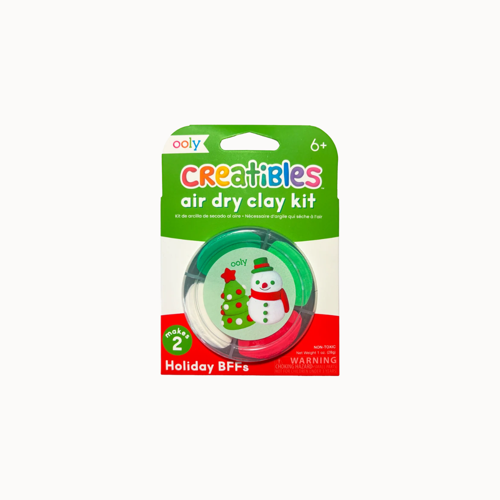 Ooly Creatibles air dry clay kit in holiday BFFs theme, featuring a green, white, and red blister pack with a visible green and red clay roll inside.