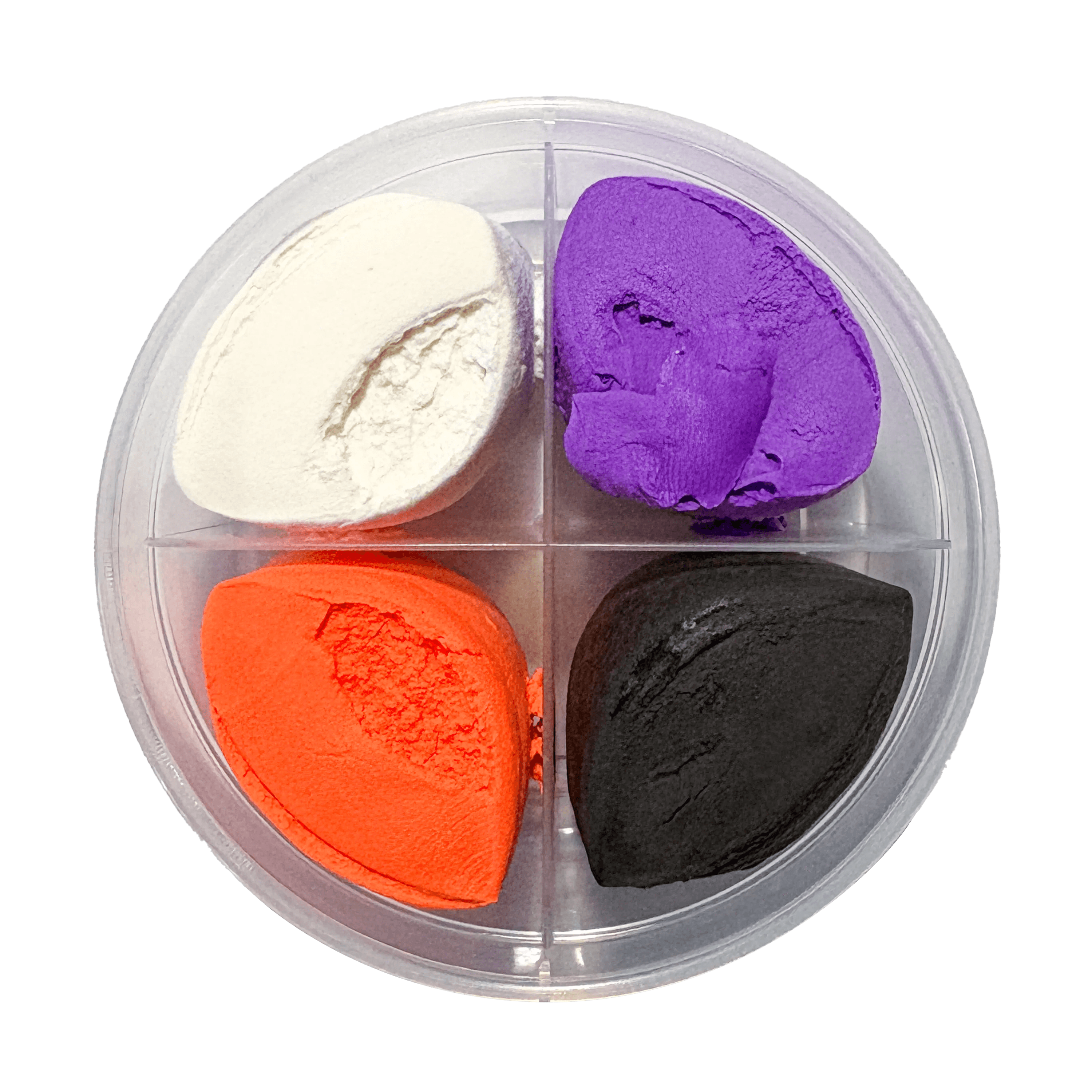Four different colored clay pieces in a clear container on a white background