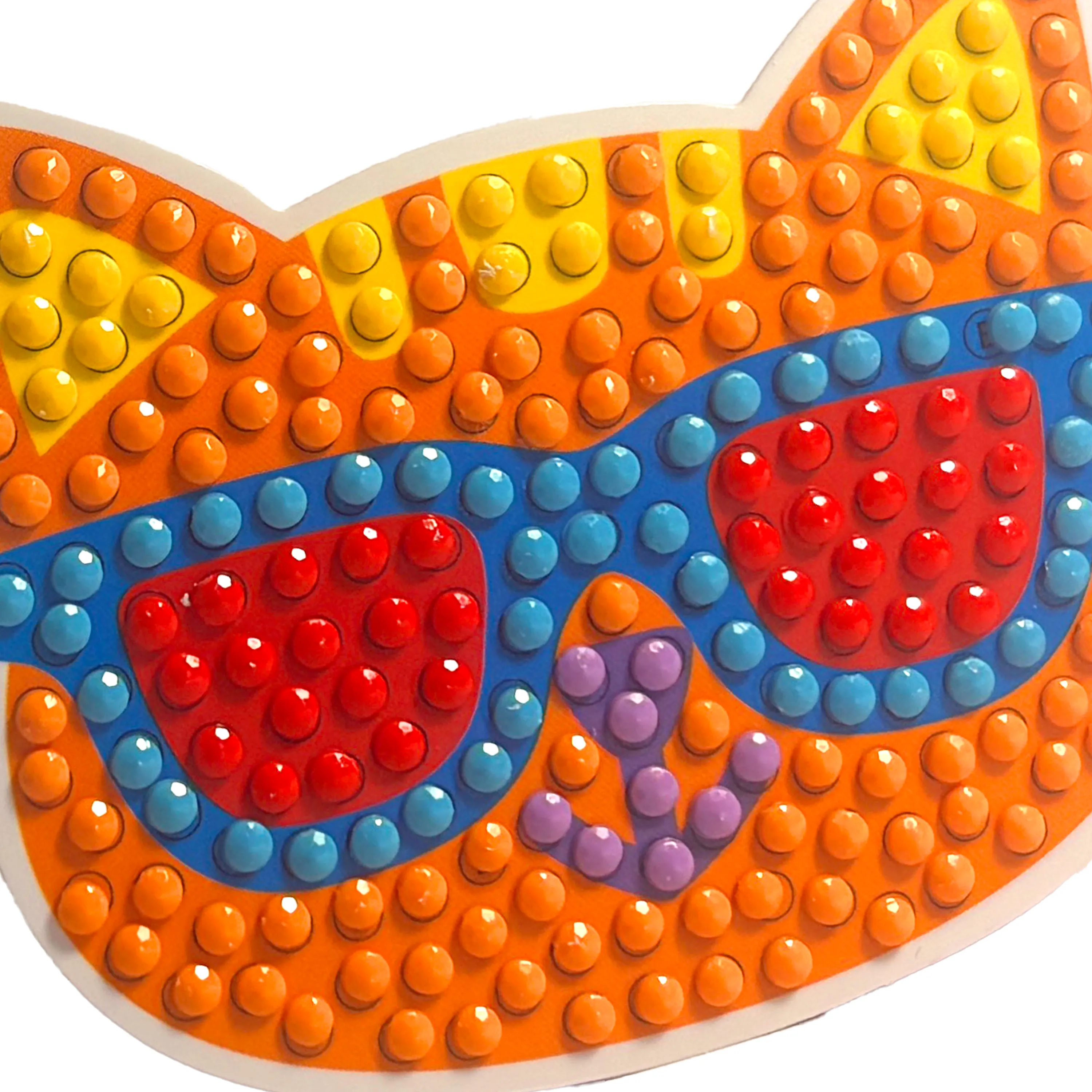 Colorful sunglasses made of interlocking bricks on a white background