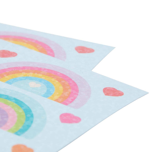 Two sheets of paper with colorful rainbow designs and pink hearts on a white background.