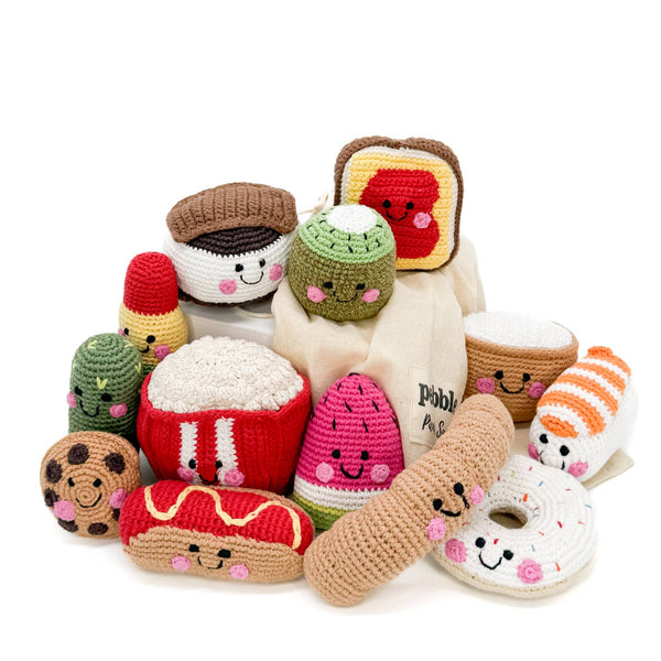 Collection of crochet food toys on a white background