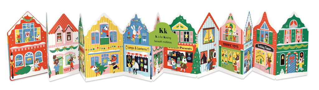 A colorful children's book or booklet featuring a row of illustrated houses and storefronts on the cover, photographed against a plain white background.