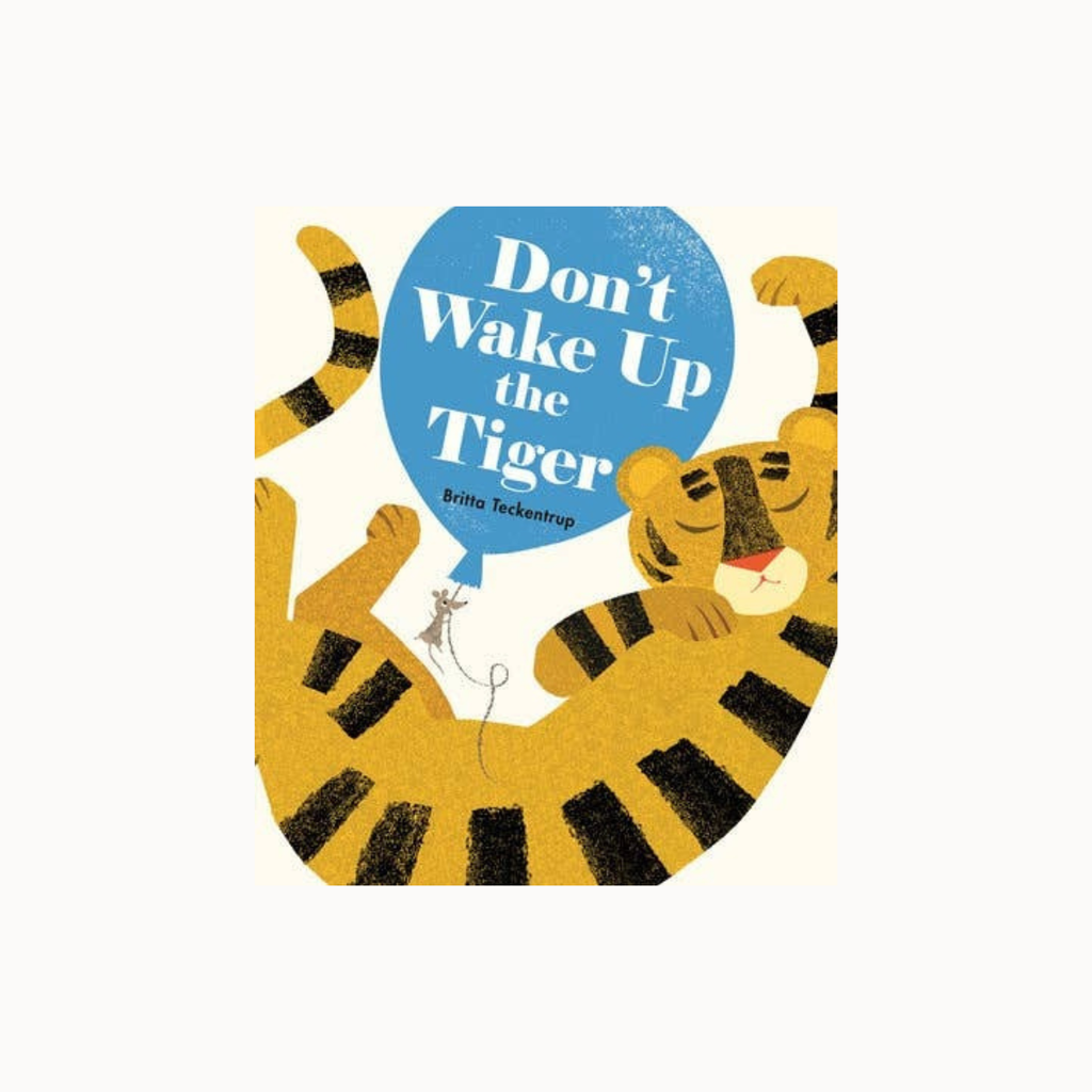 Children's book cover for 'Don't Wake Up the Tiger' by Brita Tackenberg, featuring a stylized illustration of a sleeping tiger holding a blue balloon with white text, on a light cream background.