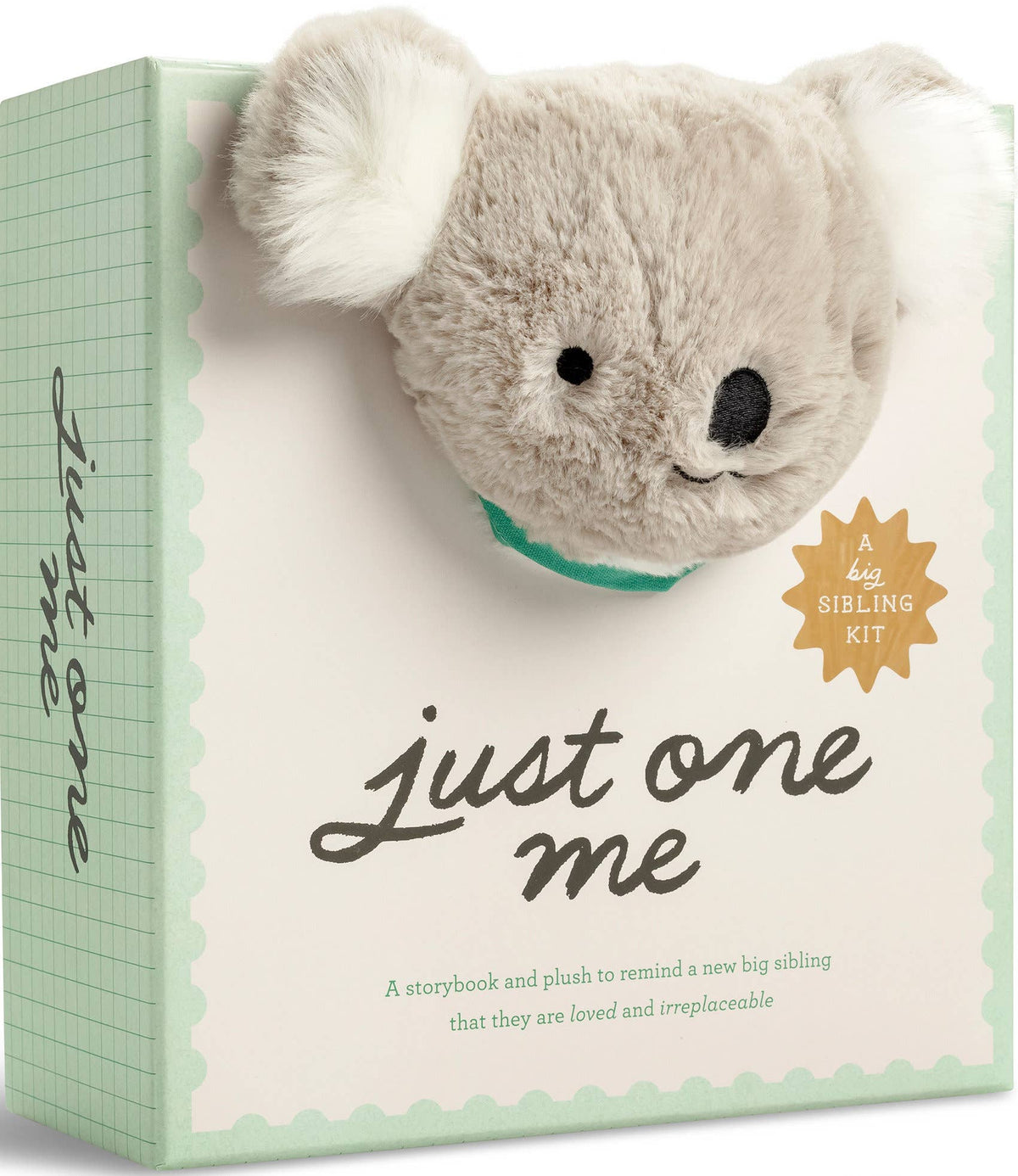 Plush toy koala in a box with 'Just One Me' branding