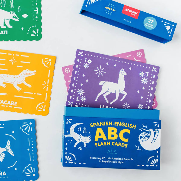 Spanish-English ABC flash cards with colorful designs on a white background