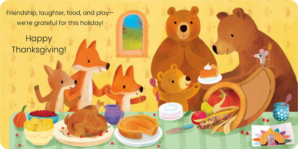 A children's holiday illustration showing a Thanksgiving family meal with bears, foxes, and a mouse around a cornhole board, pie, pumpkin, and food. Text on the left reads, 'Friendship, laughter, food, and play—we're grateful for this holiday! Happy Thanksgiving!' The artwork is colorful and fills the frame.