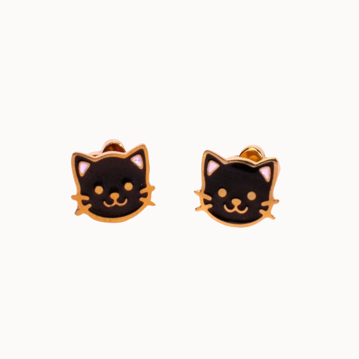 Pair of gold earrings on a white background