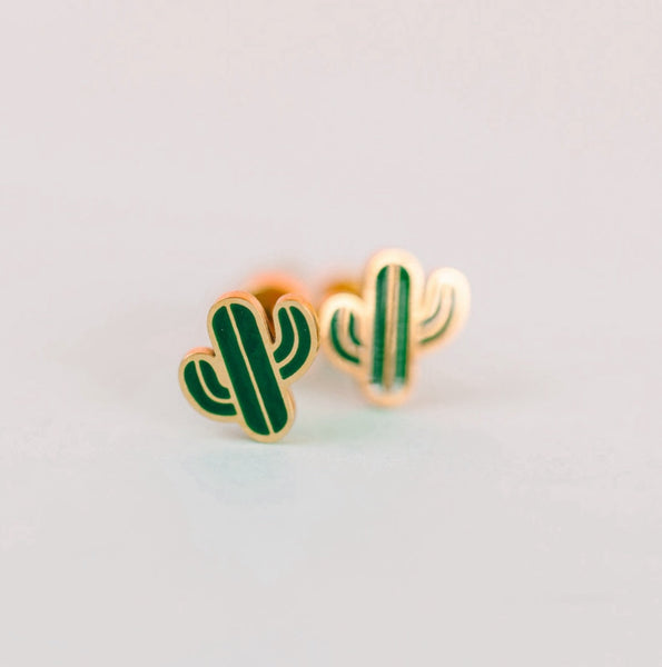 Cactus-shaped earrings on a light gray background