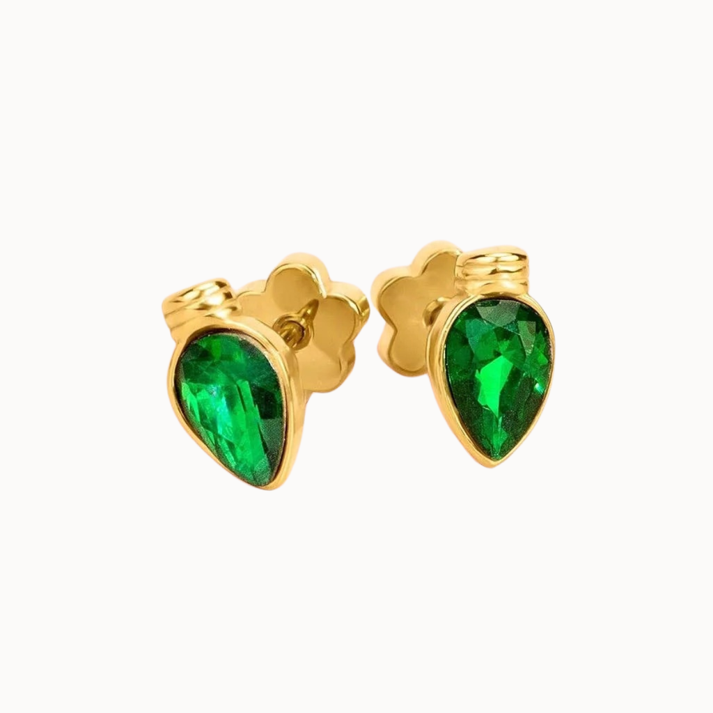 A pair of gold stud earrings featuring faceted green teardrop-shaped gemstones in gold settings, shown against a plain white background.