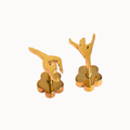 A pair of gold-toned cufflinks shaped like stylized ballerina figures standing on flower-shaped bases, shown against a plain white background.