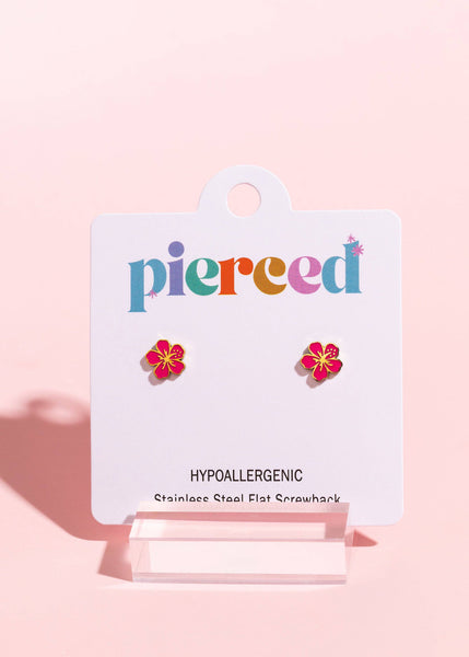 Flower-shaped earrings on a 'pierced' branded card against a pink background