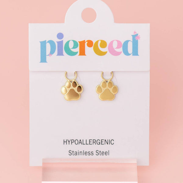 Gold paw-shaped earrings on a 'pierced' branded card with a pink background