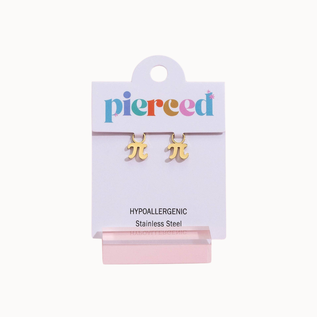 A pair of gold-plated stainless steel pi symbol stud earrings on a white display card with the brand name 'pierced' in multicolored letters. The card also reads 'HYPOALLERGENIC Stainless Steel' and is displayed on a pink stand against a light off-white background.