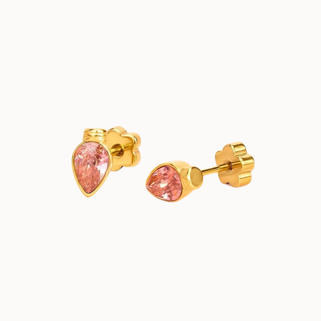 A pair of gold stud earrings with pear-cut pink gemstones, shown on a clean off-white background.