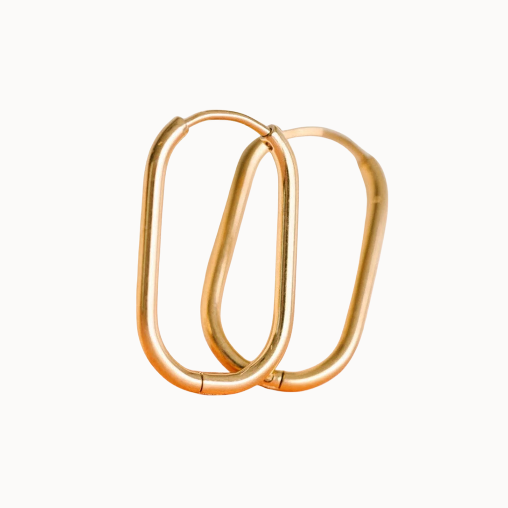 Gold hoop earrings on a white background