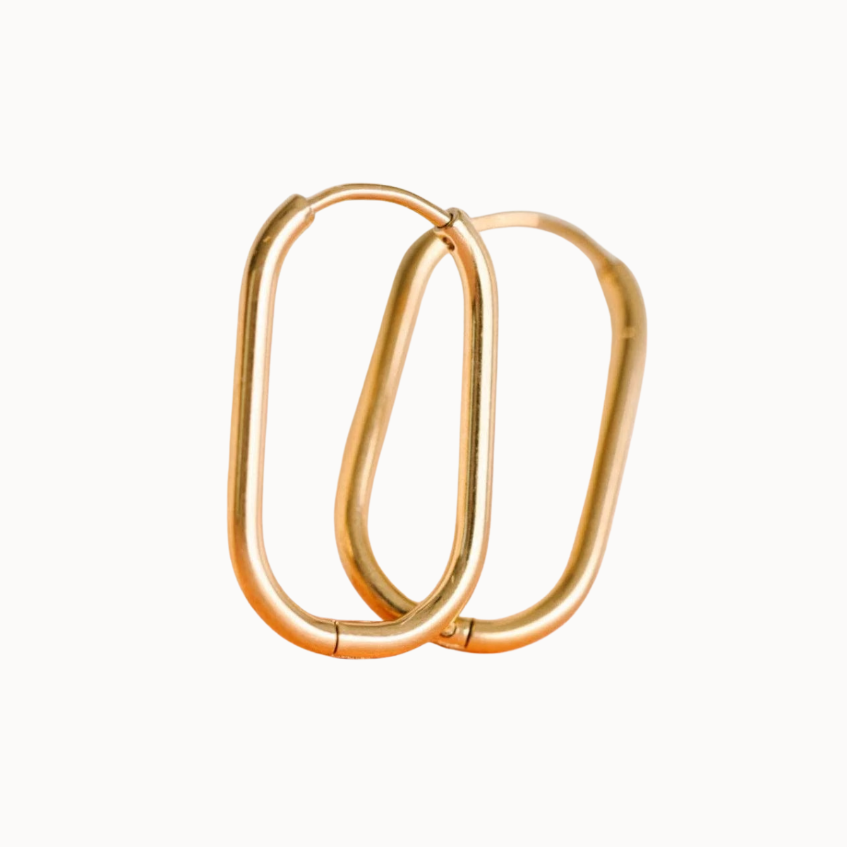 Gold hoop earrings on a white background